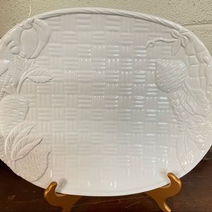 Large white platter, weave design with veggies around edge.